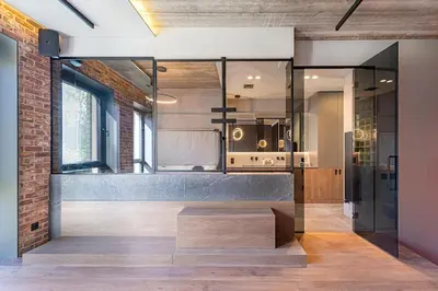 a bathroom with a glass walled shower with a bench at Design 2 BD Apartment with Hot Tube by Domvia in Kaunas