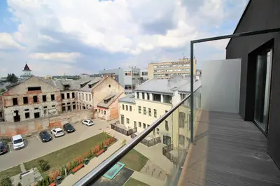 an apartment balcony with a view of a city at Lovely Flat with Great Central Location Kaunas in Kaunas