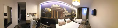 a room with a picture of a building on the wall at Vilnius City Room in Vilnius