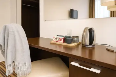 a towel hanging on a desk in a room at Vilnius City Room in Vilnius