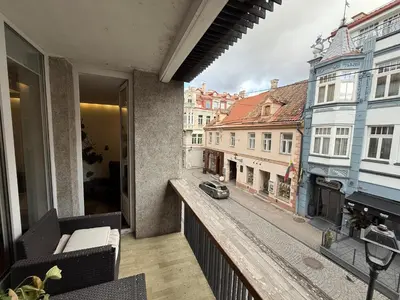 a balcony with a view of a city street at Pilies23 Old Town Luxury Apartment in Vilnius