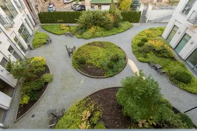 an overhead view of a garden with benches and trees at Vilnius City Center Deluxe Apartment in Vilnius