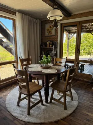 a dining room with a table and chairs at Piliakalnio Apartmentai in Kupiškis