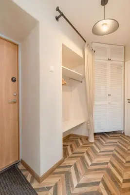 a room with a hallway with a closet at Cozy Urban Apartment in Vilnius