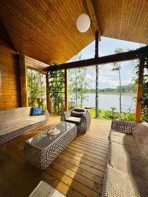 a living room with couches and a view of the water at Lake terrace