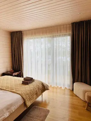a bedroom with a bed and a large window at Lake terrace