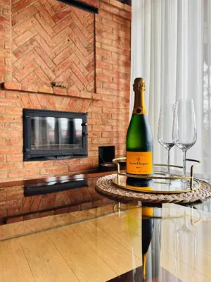 a bottle of wine on a table with two wine glasses at Lake terrace