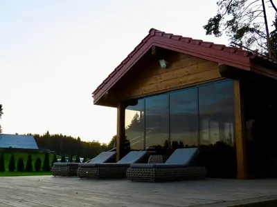 a gazebo with chairs and windows on a deck at Lake terrace