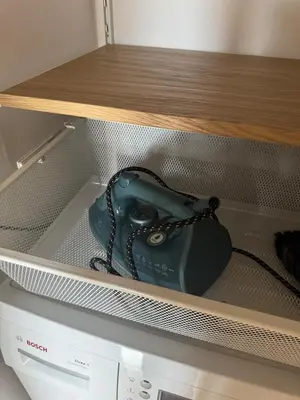 a purse is sitting on top of an appliance at Studio Apartment with Balcony in Central Druskininkai in Druskininkai