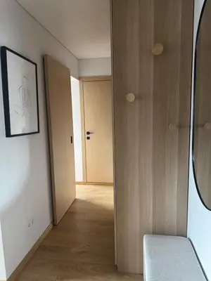 a room with a hallway with a door and a mirror at Studio Apartment with Balcony in Central Druskininkai in Druskininkai