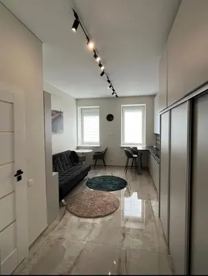 a living room with a couch and a table at Luxury center in Kaunas