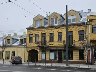 a yellow building on the side of a street at Luxury center in Kaunas