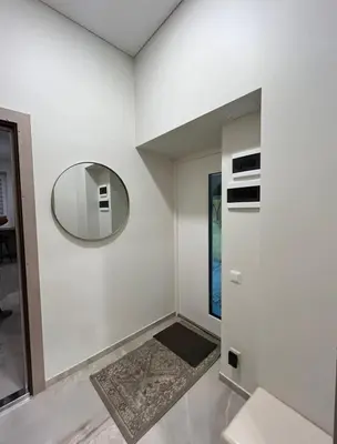 a white room with a mirror on the wall at Luxury center in Kaunas