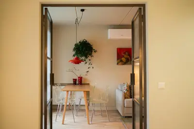a dining room with a table and chairs at Pievos in Birštonas