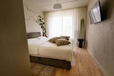 a bedroom with a bed with two pillows on it at Pievos in Birštonas
