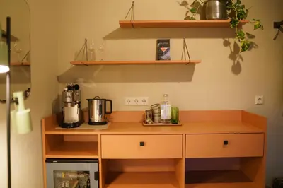 a kitchen with a counter with a coffee maker on it at Pievos in Birštonas