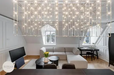a living room with a couch and a table at Luxury apartment in Old Town and Parking in Vilnius