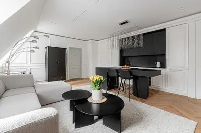 a living room with a couch and a table at Luxury apartment in Old Town and Parking in Vilnius