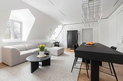 a living room with a couch and a table at Luxury apartment in Old Town and Parking in Vilnius