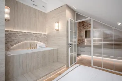 a bathroom with a tub and a sink and a shower at Luxury apartment in Old Town and Parking in Vilnius