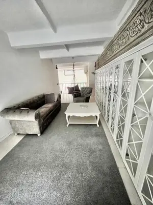 a living room with a couch and a table at Kaunas Design Loft in Kaunas