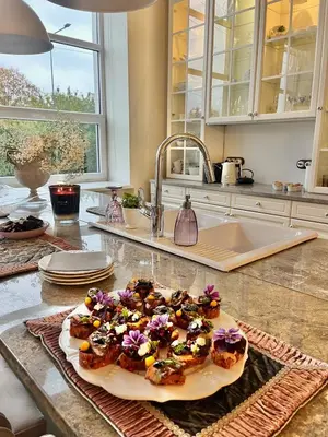 a plate of donuts on a counter in a kitchen at Kaunas Design Loft in Kaunas