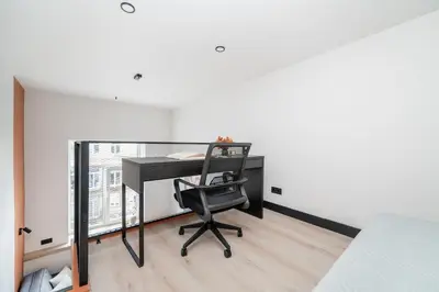 an office with a desk and a chair in a room at Vytenio Loft - Serenity and Style in City Centre 23 in Vilnius
