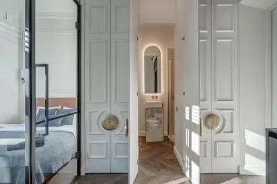 a bedroom with a bed and a glass door at New! Design OLD TOWN apartment in Vilnius