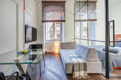 a living room with a couch and a glass table at New! Design OLD TOWN apartment in Vilnius