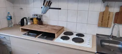 a kitchen counter with a stove and a sink at CheapStayVilnius in Vilnius