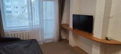 a room with a flat screen tv on a wall at CheapStayVilnius in Vilnius