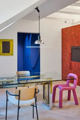 a dining room with a glass table and two chairs at Pop Haus Vilnius in Vilnius