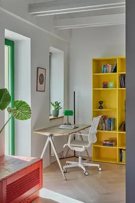 an office with a desk with a computer and a chair at Pop Haus Vilnius in Vilnius