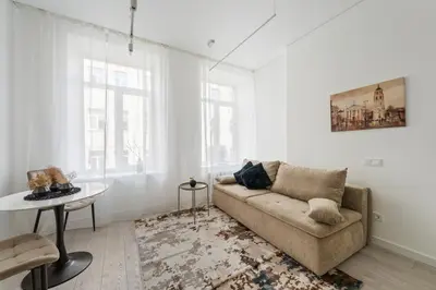 a living room with a couch and a table at Close to Old Town & Amenities 1 in Vilnius