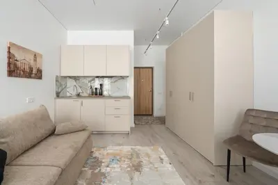 a living room with a couch and a kitchen at Close to Old Town & Amenities 1 in Vilnius