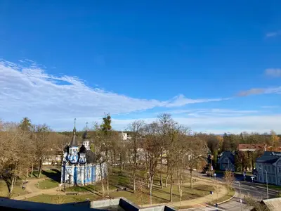 a park with a clock tower in a city at Luxury Oasis in the Heart of the City in Druskininkai