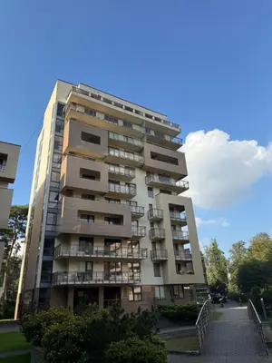 a tall building with balconies on the side of it at Luxury Oasis in the Heart of the City in Druskininkai