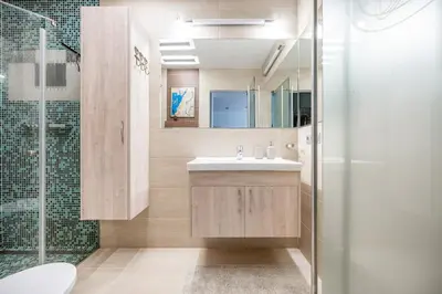 a bathroom with a sink and a shower at Studio in central Vilnius in Vilnius