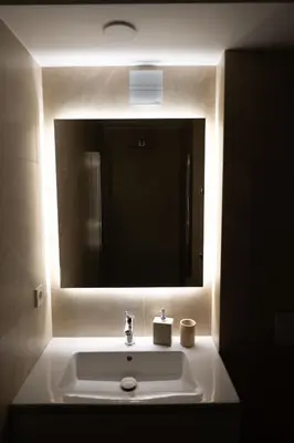 a bathroom sink with a large mirror above it at Vytauto 12 - jaukūs apartamentai centre - Self Check-in in Marijampolė