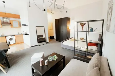 a living room with a couch and a table at Gedimino Avenue Central Apartment in Vilnius