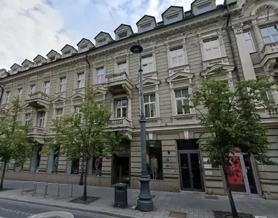 a building with a street light in front of it at Gedimino Avenue Central Apartment in Vilnius