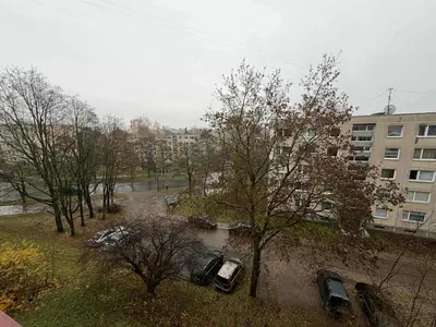an aerial view of cars parked in a parking lot at Two Bedroom Apartment LAZDYNAI in Vilnius