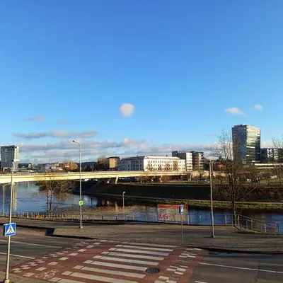 a view of a city with a river and buildings at VilniusCentralSpot in Vilnius
