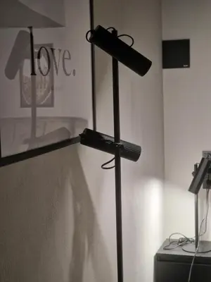 a metal cross on display in a room at Stylish loft in Vilnius