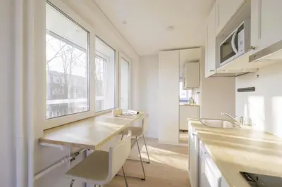 a kitchen with a counter and a sink and a window at Vilnius prie centro ramybė tarp medžių in Vilnius
