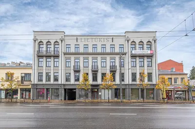 a large white building on a city street at Vytauto 43 Residence – Lietūkis by Domvia in Kaunas