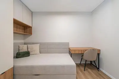 a small bedroom with a bed and a desk at Vytauto 43 Residence – Lietūkis by Domvia in Kaunas