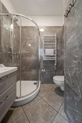 a bathroom with a shower and a toilet at Bernardinu Boutique in Vilnius