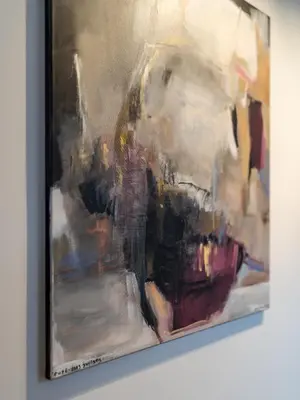 a painting is hanging on a wall at Bernardinu Boutique in Vilnius