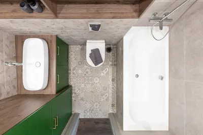 a bathroom with green cabinets and a white shower at Kaunas old town apartment in Kaunas
